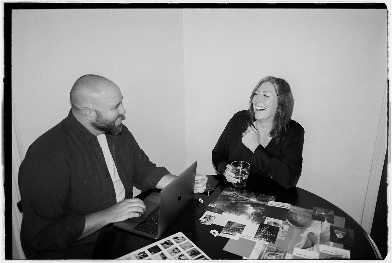 website designers, Karie and Field denny at a table discussing design